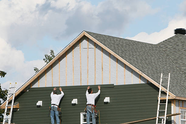 Professional Storm Damage Siding Repair technician working in Urbana, OH
